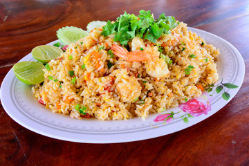 Thai food, delicious sea food fried rice on wood table.