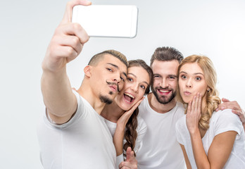 Happy friends taking selfie