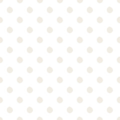 Hand-drawn polka dot seamless pattern. Light beige color. Simple and nice.