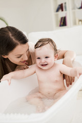 Mother Bathing Her Baby