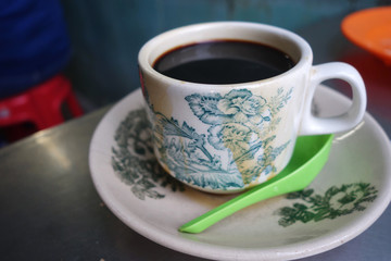 Steaming traditional oriental Chinese style dark coffee