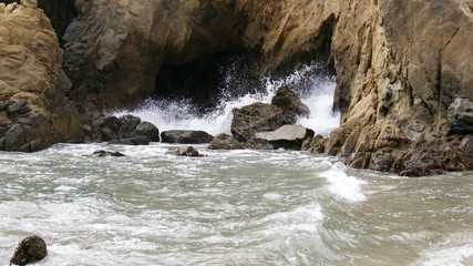 BIG SUR, CALIFORNIA, UNITED STATES - OCT 7, 2014: Huge ocean waves crushing on rocks at Pfeiffer...