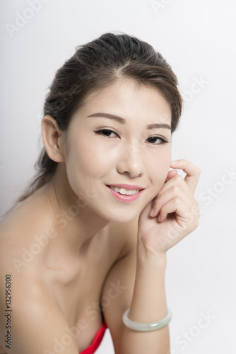 young-woman-looking-at-camera-with-a-seductive-smile-stock-photo-and