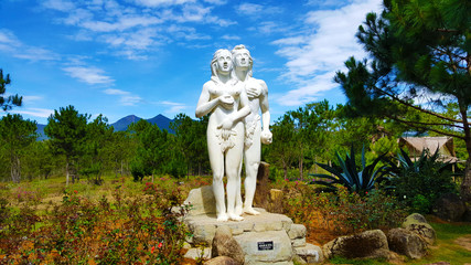 Adam and Eve in Valley of Love Da Lat - obrazy, fototapety, plakaty