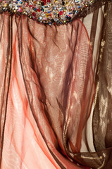 Pink brown transparent fabric. texture. robe.