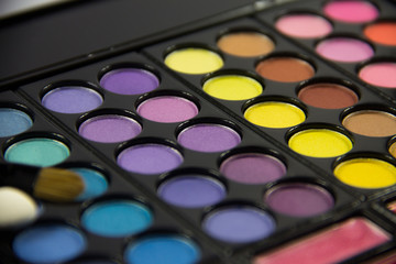 Naklejka premium Eyeshadow Palette. Decorative cosmetics. Makeup brushes