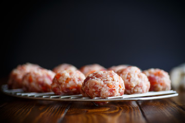 raw meatballs tangled meat with carrots