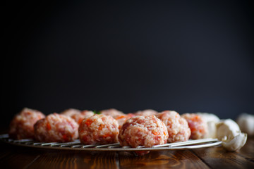 raw meatballs tangled meat with carrots