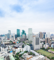 Obraz premium Business and culture concept - panoramic modern city skyline bird eye aerial view from tokyo tower under dramatic morning blue cloudy sky in Tokyo, Japan