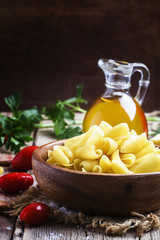Ingredients for cooking pasta, old wooden table, rustic style, s