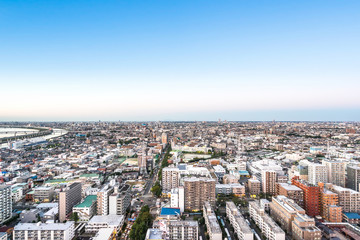 Fototapeta na wymiar Business and culture concept - panoramic modern city skyline bird eye aerial view under dramatic sunset glow and beautiful cloudy sky in Tokyo, Japan
