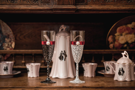 Wedding wine glasses on the antique sideboard