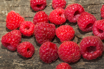 Raspberries on vintage wooden boards