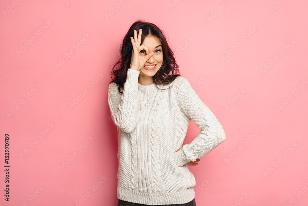 Wall mural young cheerful girl showing zero gesture.