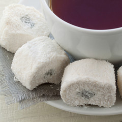 cup with tea and white Turkish delight