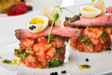 slice of veal with vegetables.