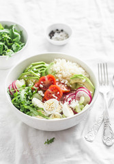 Couscous and vegetables bowl. Healthy, diet, vegetarian food concept. On a light background . Vegetarian buddha bowl