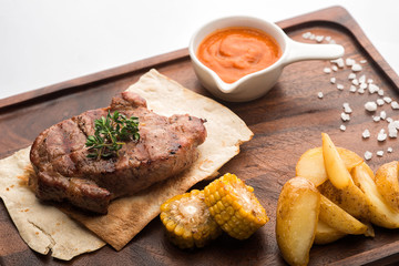 Pork steak on a pita.