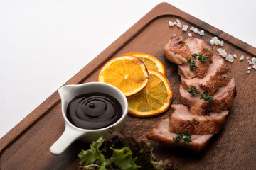 Duck fillet. On a wooden surface.