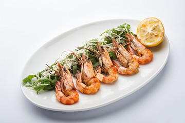 Fried shrimp on a white plate.