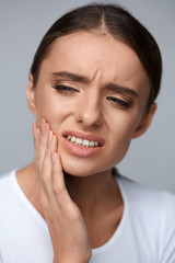 Teeth Pain. Beautiful Woman Suffering From Painful Toothache
