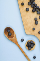 Naklejka na ściany i meble Fresh blueberry on wooden spoon