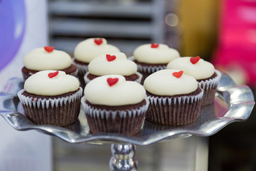 Chocolate cupcakes with white frosting
