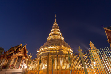 Fototapeta premium Wat phra that hariphunchai pagoda temple important religious tra