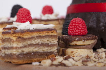 Tasty chocolate cake on a wooden base