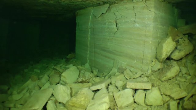 The camera moves to the junction of tunnels of a flooded mine.

