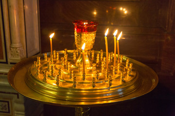 Burning candles in a church