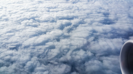 view the outer aircraft on the sky above the clouds in morning
