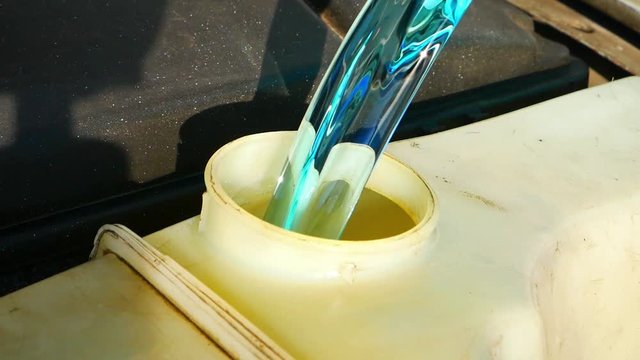 Somebody fill in liquid in the car.
