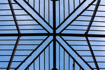 Metal roof structure with blue sky. 