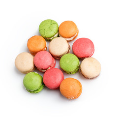 Fototapeta na wymiar Colorful macaroons isolated on white with space for text. Traditional french dessert. Top view, flat lay.