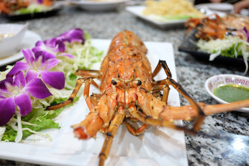 lobster with garilc on the table