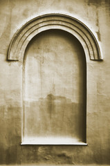 Old aged plastered faux arch false fake window stucco frame background, vertical copy space