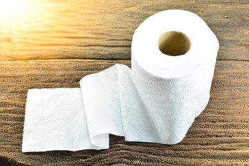 White tissue paper and white flower put on the old bark, wood at the morning