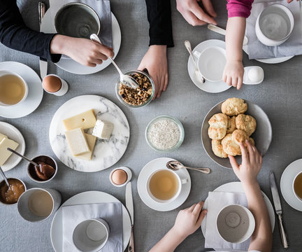 Overhead view of people having breakfast on table
