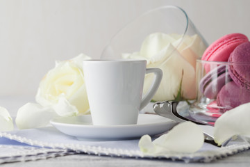 Still life with cup of coffee and flowers