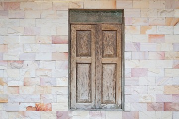 Fototapeta na wymiar old wooden window vintage style on rock brick wall