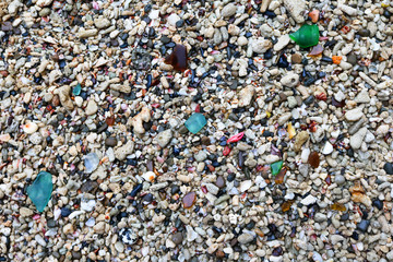 Background image of sand and coral, glass on the beach. 