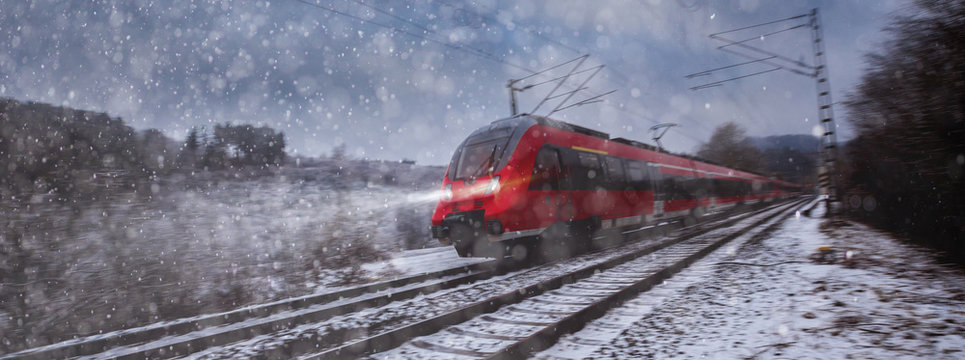 Fototapeta red train speeding in the snow