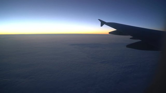 Wing of an airplane in the sunrise