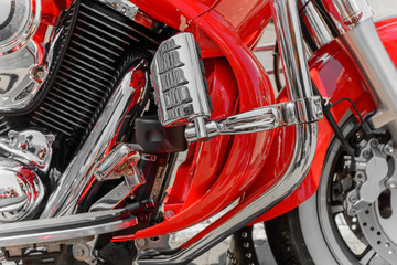Fototapeta na wymiar Closeup of red motorcycle. Beautiful modern red motorcycle headl