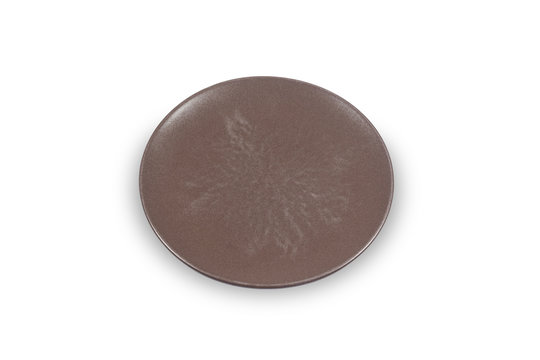 Dark brown flat shallow ceramic plate on white background directly from high angle