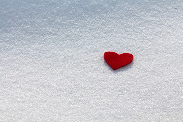Fototapeta premium Red heart in the snow