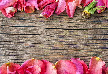 roses petals on wooden table