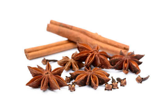 Aromatic star anise, cloves and cinnamon isolated on white background