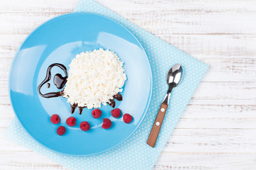 Cottage cheese in the shape funny lamb. Food for kids. Children's breakfast. Top view, copy space